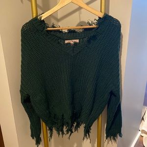 Hunter green long sleeve v-neck sweater, with fringes